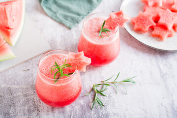 Cold watermelon drink in glasses on the table. Summer refreshing cocktails