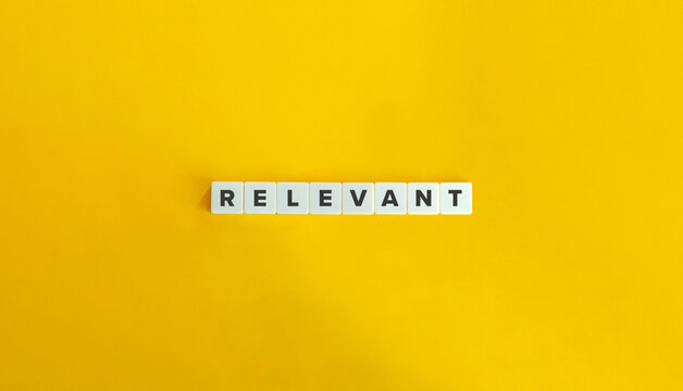 Relevant Word and Banner. Letter Tiles on Yellow Background. Minimal Aesthetics.