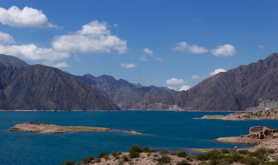Beautiful scenery with a lake and mountains on a cloudy day.
