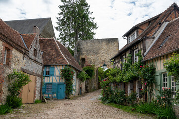 Fototapeta na wymiar One of most beautiful french villages, Gerberoy - small historical village with half-timbered houses and colorful roses flowers, France