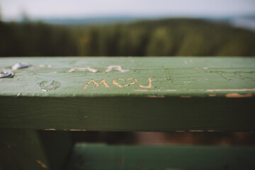 lovers initials at a wooden bridge 