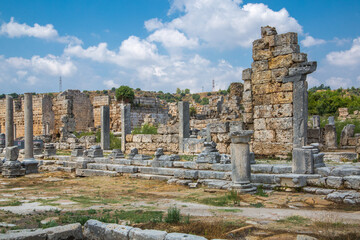 Fototapeta na wymiar Perge, Colonnaded street and ruins of private houses on the sides. Greek colony from 7th century BC, conquered by Persians and Alexander the Great in 334 BC.