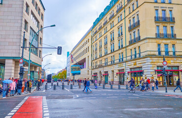 The wide street among high buildings in Berlin, Germany