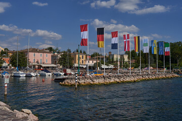 Bardolino, Italy - July 11, 2022 - Cisano - the small boat harbor on a summer afternoon       