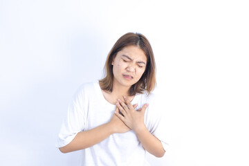 Asian woman has chest pain from heart disease and coronary artery disease, health problems.