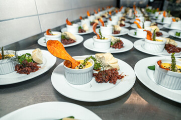 Crème brûlée from a duck with a piece of a baguette, sweet potato and some meat as an appetizer ready to be served in the kitchen