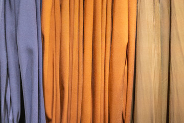 autumn collection of clothes in pastel colors in a store in a mall. High quality photo