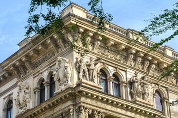 Sculptures and mascarons on the facade of the building on Andrássy Avenue. Budapest. Hungary