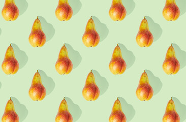 Pattern of pears on green pastel background