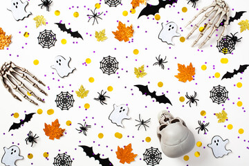Halloween pattern made of bats, ghosts, spiders, webs, skeleton arms, skull on white background....