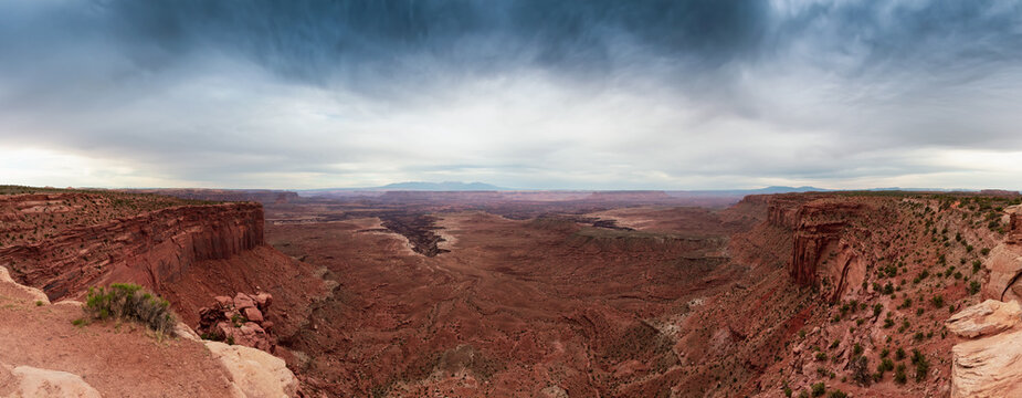 Scenic Panoramic View of American Landscape and Red Rock Mountains in Desert Canyon. Cloudy Sky. Canyonlands National Park. Utah, United States. Nature Background Panorama © edb3_16