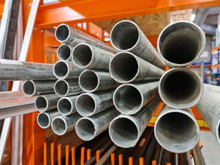 Profile of iron pipes in a warehouse shop for sale of metal structures   
