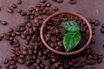 Close up of roasted coffee beans and leaves