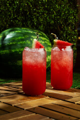 Watermelon juice on a green lawn