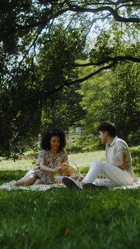 A couple on a date preparing for a picnic