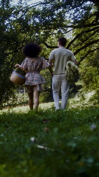 A couple on a date preparing for a picnic