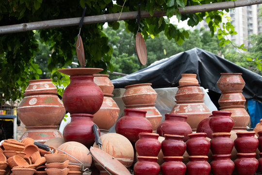 Handmade Terracotta Ceramic Clay-Based Earthenware Used For Cooking Or Storing Food And During Traditional Festival Celebration In India. Piled Up Variety Of Unglazed Or Glazed Hard, Fired Ceramic