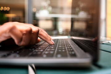 Close up of copywriter hand typing on keyboard, working freelance project sitting at workplace. Business woman using laptop computer, searching information on website, shopping online, selective focus