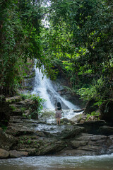 Obraz premium A vacation to a waterfall in the middle of the forest in the high valley.