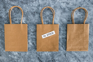 In stock text on top of shopping bags, shopping and retail