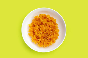 Pineapple paste or jam on green background.