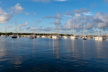 Fototapeta na wymiar Dinner Key Marina in Miami, Florida in early morning light on calm sunny summer morning.