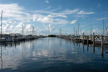 Dinner Key Marina in Miami, Florida in early morning light on calm sunny summer morning.