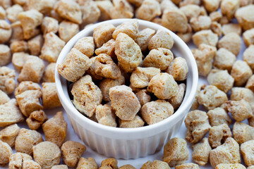 Textured soy protein on white background.