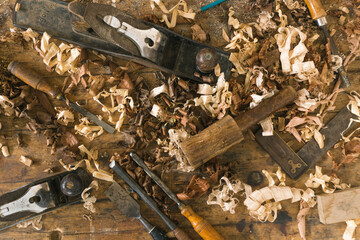 Carpentry tools. A carpenter's work table, full of tools and wood waste. Local carpentry of the town. Acerrin, material and tools. Elements of daily use in a craft carpentry