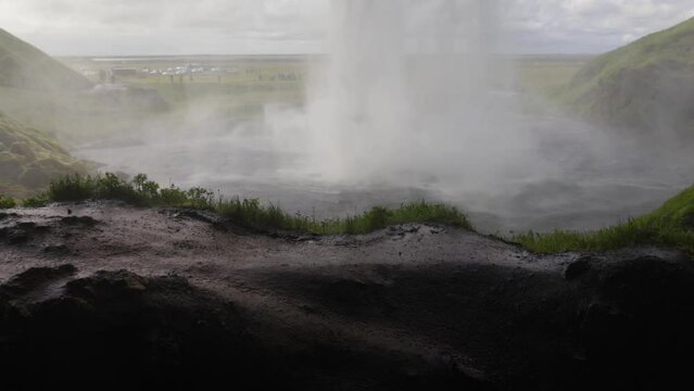 Seljalandsfoss Falls in Iceland with gimbal video walking behind falls and sideways.