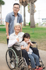 family times , asian children and asian adult relax in garden, mother day, old patient feeling happy with her family