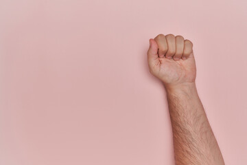 men fist vindicating on pink background flat lay with copy space