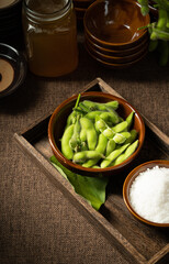 Fresh edamame on a wooden plate