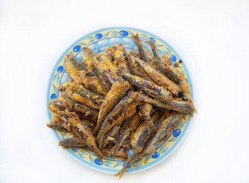 fried sardines and anchovy in white background  