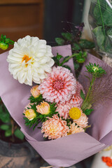 Beautiful flower composition with autumn pink and white floand. Autumn little bouquet.