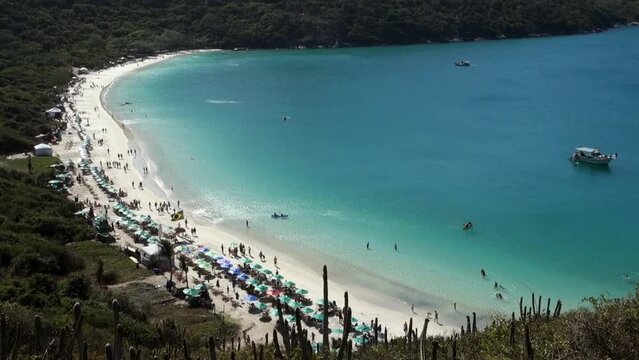 aerial tilt up view of idyllic Forno beach in Arraial do Cabo, RJ, Brazil