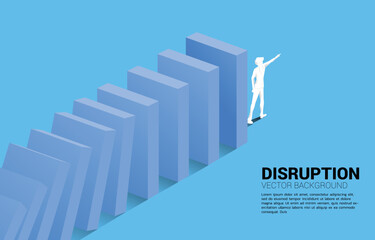 Silhouette of businessman point forward at the end of domino collapse. Concept of business industry disrupt