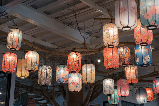 Colorful electric lantern hanging on the ceiling at the entrance of building