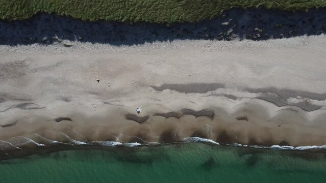 beautiful white beach filmed from above with a drone, in bulbjerg in denmark