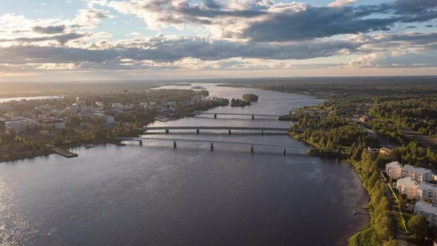 Hyperlapse of clouds moving over bridges and the city of Tornio, summer evening in Finland