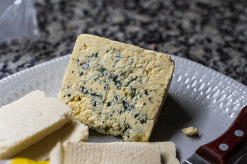 types of cheese on a wooden table