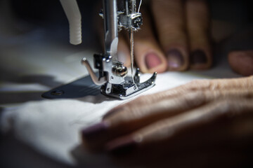woman sewing on machine