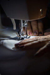 woman sewing on machine