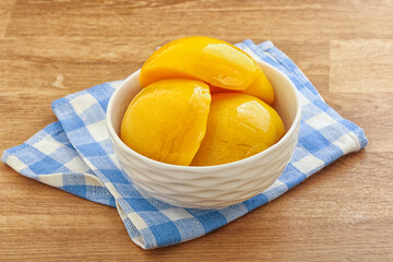 Sweet canned peaches with syrope