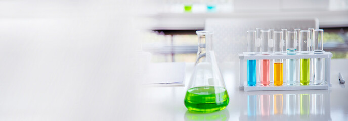 Banner Science chemistry glass tubes object on lab background. Wide Liquid tube biology laboratory...