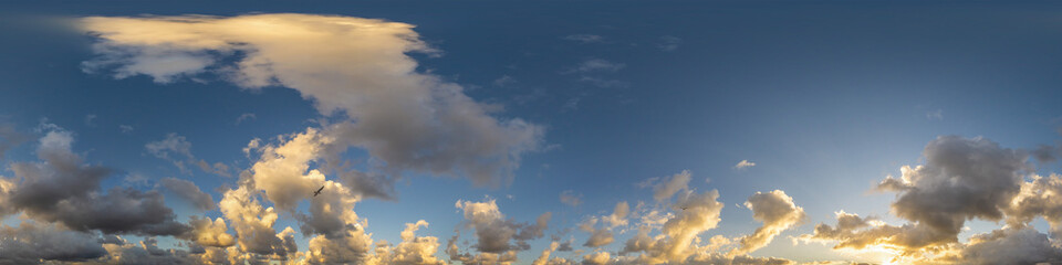 Dark blue sunset sky panorama with Cumulus clouds. Seamless hdr pano in spherical equirectangular format. Complete zenith for 3D visualization, game and sky replacement for aerial drone 360 panoramas.