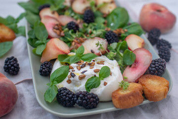 Peach, blueberry salad with vegetables, feta cheese