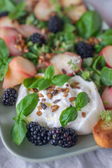 Peach, blueberry salad with vegetables, feta cheese