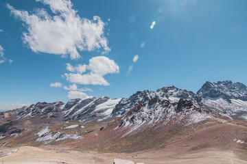 Amazing Mountainous Landscape In Peru.

photography of huaraz peru, with people with hiking clothes, lakes, mountains, colors, rainbow mountain.