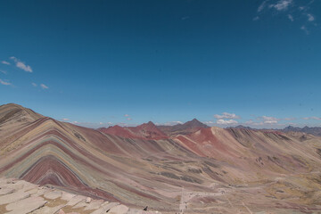 Amazing Mountainous Landscape In Peru.

photography of huaraz peru, with people with hiking clothes, lakes, mountains, colors, rainbow mountain.